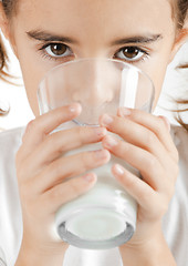 Image showing Little girl drinking milk