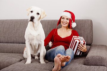 Image showing Woman with her dog on Christmas Day