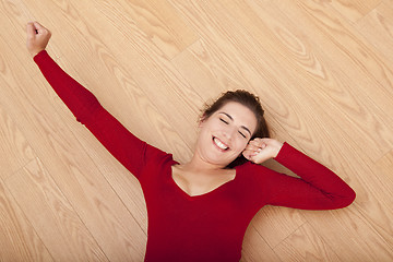 Image showing Happy woman on the floor