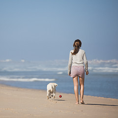 Image showing Walking with her dog