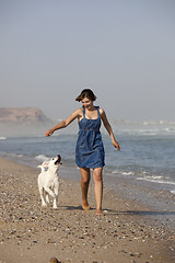 Image showing Girl with her dog
