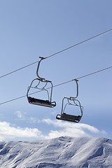 Image showing Chair lifts and off piste slope at nice day