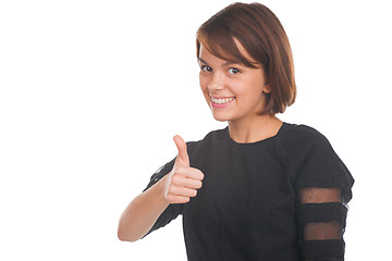 Image showing Teenage girl showing thumbs up and smiling