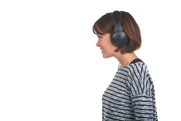 Image showing Pretty young girl listening music