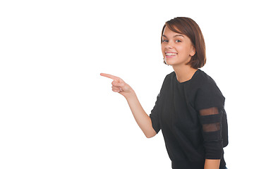 Image showing Girl pointing at something and smiling