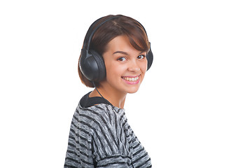 Image showing Pretty young girl listening music