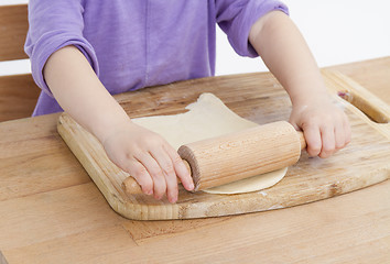 Image showing rolling out dough for pizza