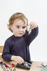 Image showing child repairing hard disk drive