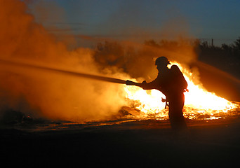 Image showing firefighter in silhouette