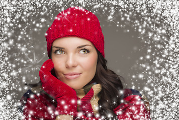 Image showing Mixed Race Woman Wearing Winter Hat and Gloves Enjoys Snowfall
