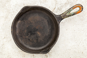 Image showing iron pan on a ceramic tile