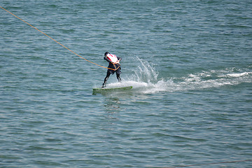 Image showing the athlete of water skiing on a water ski