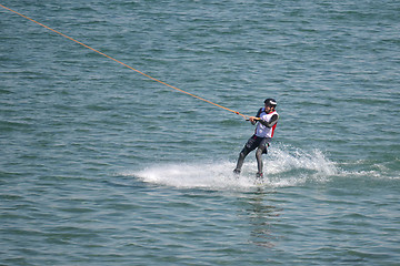 Image showing the athlete of water skiing on a water ski