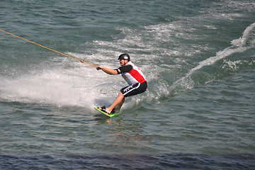 Image showing the athlete of water skiing on a water ski