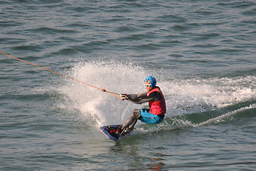 Image showing the athlete of water skiing on a water ski