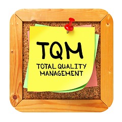 Image showing TQM. Yellow Sticker on Bulletin.