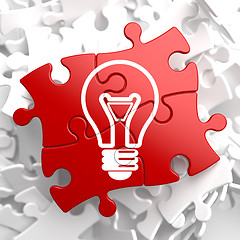 Image showing Light Bulb Icon on Red Puzzle.