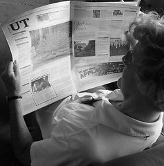 Image showing Reading the paper