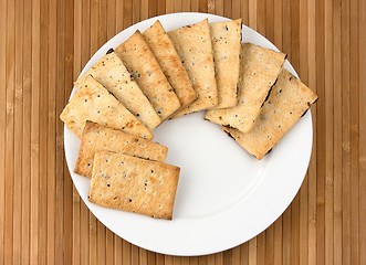 Image showing Pile of chocolate chip cookies on a dish