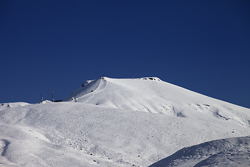 Image showing Off-piste slope with traces of skis at nice sunny day