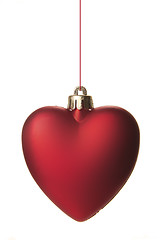 Image showing red christmas ball as heart hanging isolated