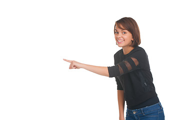 Image showing Girl pointing at something and smiling