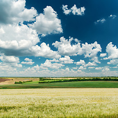 Image showing deep blue sky with clouds and green landscape