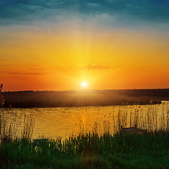 Image showing orange sunset over river