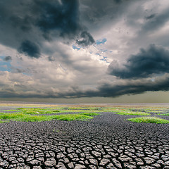 Image showing darken dramatic sky over cracked earth