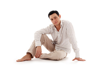 Image showing relaxed man sitting on the floor