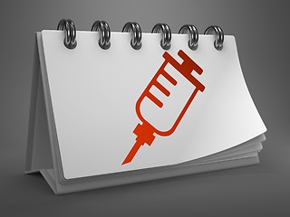 Image showing Desktop Calendar with Syringe Icon.