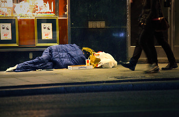 Image showing Homeless man sleeping on the street