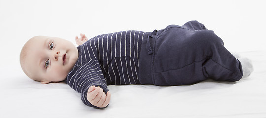 Image showing smiling toddler lazing around