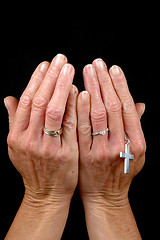 Image showing Hands, rings and cross