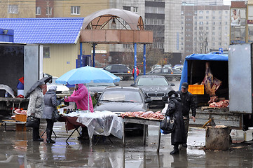 Image showing Agricultural fair. Trade in meat on the street.