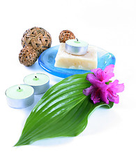 Image showing Green leaf, soap and candle