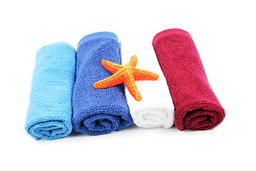 Image showing Colorful towels and orange starfish