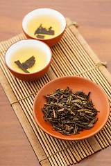 Image showing Teapot and dried tea leave
