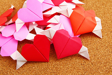 Image showing Group of origami colorful heart on corkboard