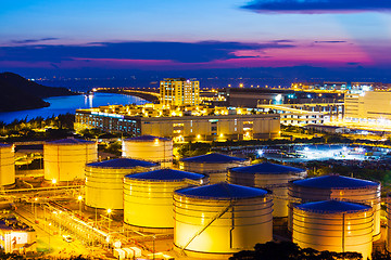 Image showing Oil tanks plant during sunset