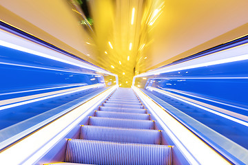 Image showing Movement of diminishing hallway escalator