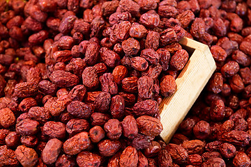 Image showing Dried red jujube with wooden container