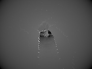 Image showing Shattered bulletproof glass with bullet hole