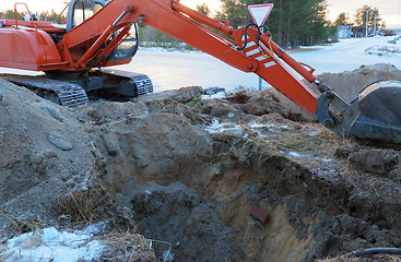 Image showing Excavator Tractor Digging a Trench.