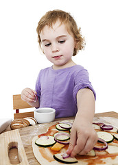 Image showing homemade pizza by a cute little girl