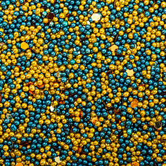 Image showing Background from Turquoise and Golden Balls of Bead