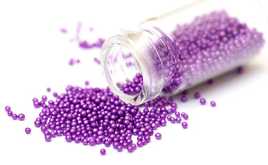 Image showing Small Glass Jar filled with Pink Balls of Bead