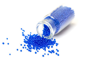 Image showing Small Glass Jar filled with Blue Balls of Bead