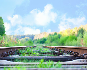 Image showing railroad to horizon under deep blue sky in sunset