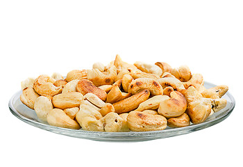 Image showing Saucer with roasted cashew nuts isolated on white background